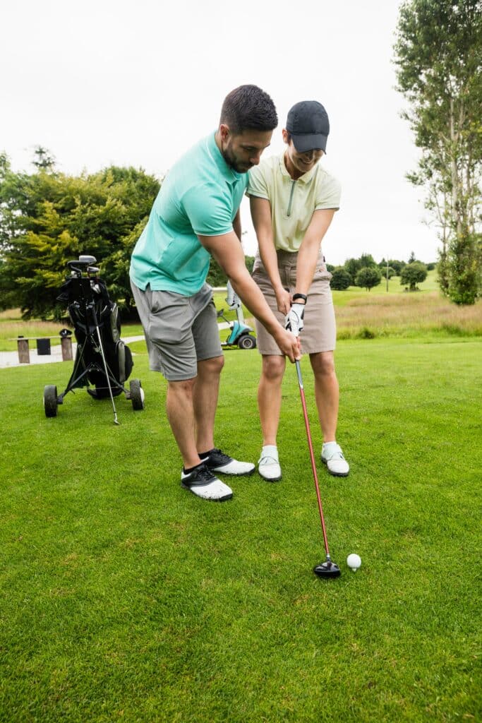 4 questions women should ask before learning to golf, image of student and golf instructor